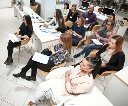 businessman holding a conversation with the employees of the company.the concept of teamwork