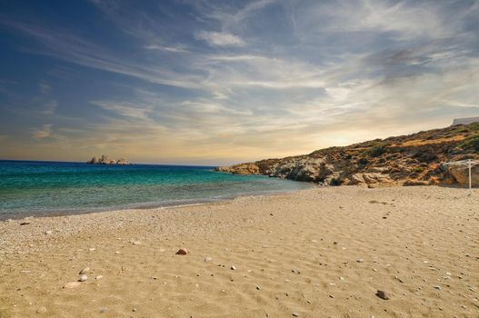 Beautiful beach of Agios Georgios in Sikinos Island with golden sand, Cyclades, Greece..