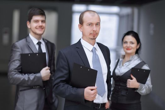 close up.a group of business people with clipboard . concept of partnership