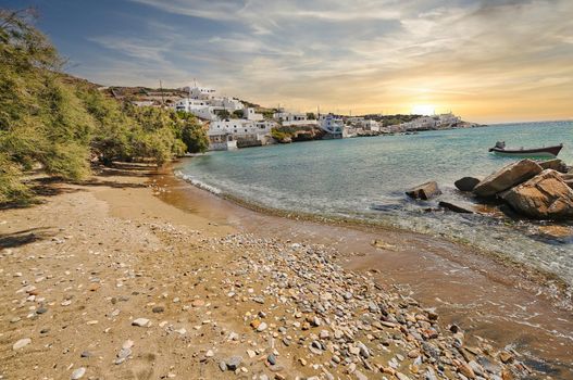 Beautiful beach and view on Sikinos Island with some trees and sand, Cyclades, Greece..