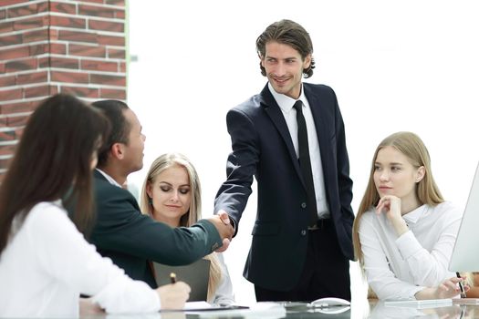 handshake Manager and customer in a modern office.photo with copy space