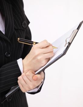closeup.business woman makes notes in a notebook.isolated on a white background