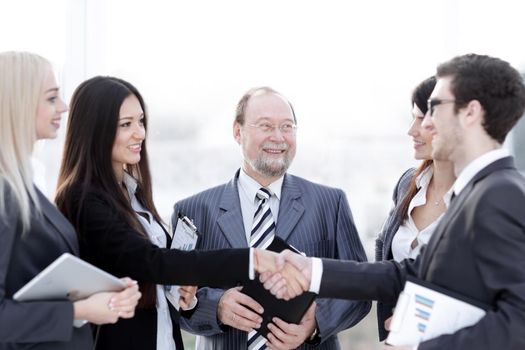 professional business team and shaking hands of young business partners in the office.photo with place for text