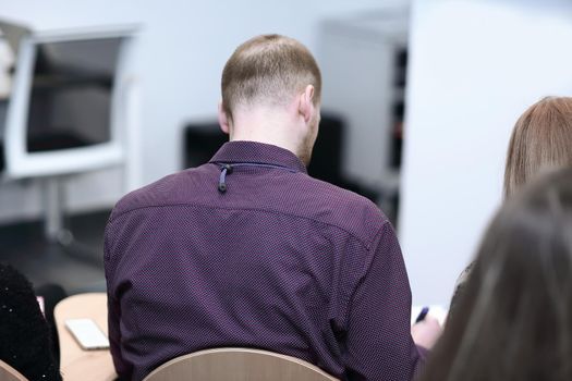 rear view.business people sitting in the conference room.close up