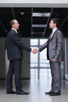 handshake of business partners in the corridor of the office.concept of partnership