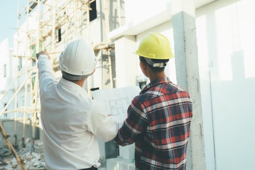 The engineering team working at building site meeting . Team onsite of architecture inspector and discuss together