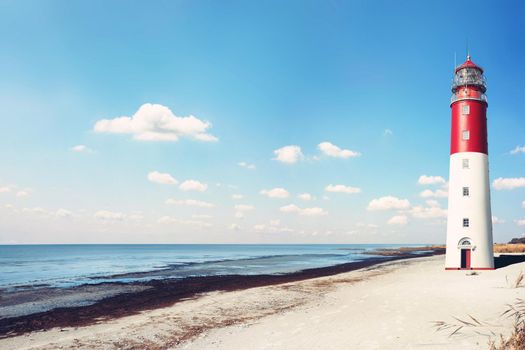 Beautiful summer seascape with lighthouse and sky