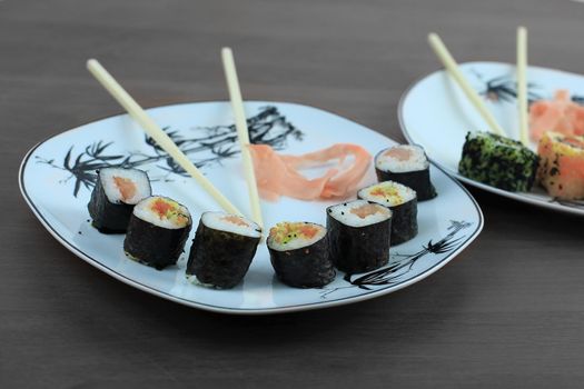 Sushi is the traditional Asian and Japanese food. Roll of sushi prepared from raw fish and a special rice.