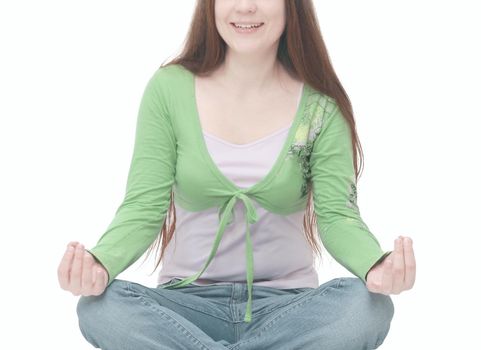 successful young woman meditating sitting on the floor.isolated on white