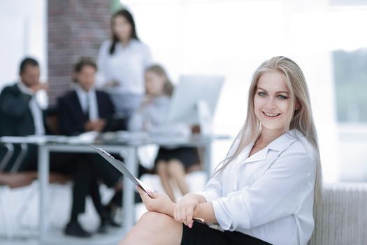 female assistant with the minutes of the meeting on the background of the office.photo with copy space.