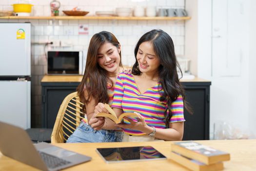 lgbtq, lgbt concept, homosexuality, portrait of two Asian women posing happy together and showing love for each other while being together.