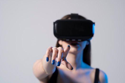 Virtual reality, technology, entertainment and people. Good-looking stylish young woman having a great time, while using the virtual vision glasses