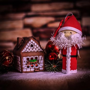 gingerbread house,Christmas balls and Santa Claus. the concept of the celebration.photo with copy space