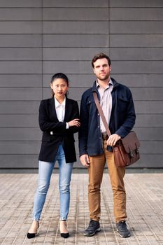 confident entrepreneur young couple looking at camera, concept of entrepreneurship and business, copy space for text