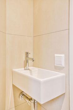 Sink with tap installed on tabletop in contemporary bathroom at home