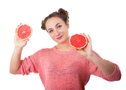 young girl with juicy and healthy grapefruits on white background