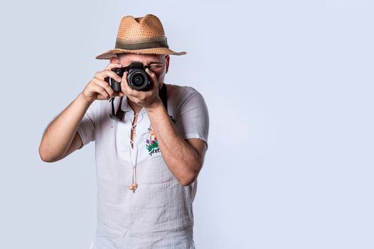 tourist in a hat with a camera, Happy tourist in a hat with a camera around his neck