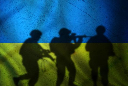 Russia vs Ukraine flag on cracked wall, concept of war between russia and ukraine, silhouette of soldiers on russia vs ukraine flag