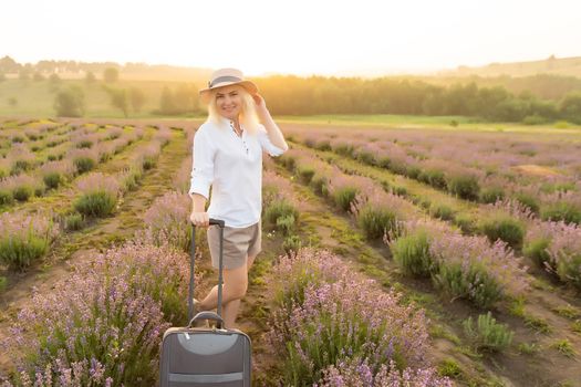 woman with bag in lavender field