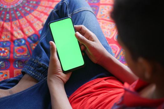 Close up of young man hand using smart phone