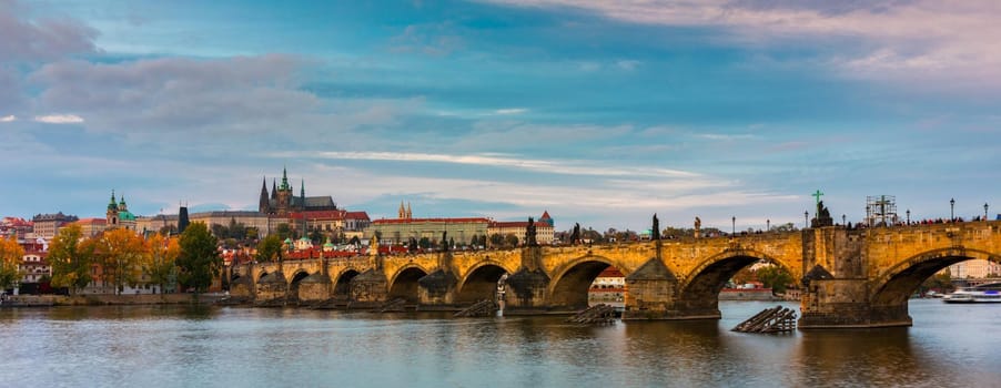 Charles Bridge in Prague in Czechia. Prague, Czech Republic. Charles Bridge (Karluv Most) and Old Town Tower. Vltava River and Charles Bridge. Concept of world travel, sightseeing and tourism.