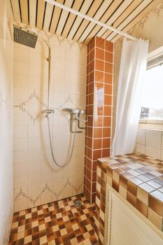 Modern shower stall in a bright bathroom