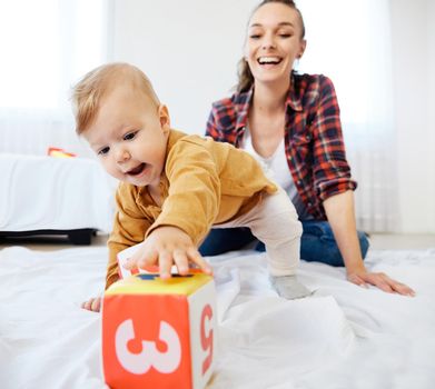 Portrait of a mother and son having fun together at home