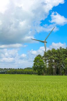 North German agricultural field wind turbines and nature landscape panorama in Lower Saxony Germany.