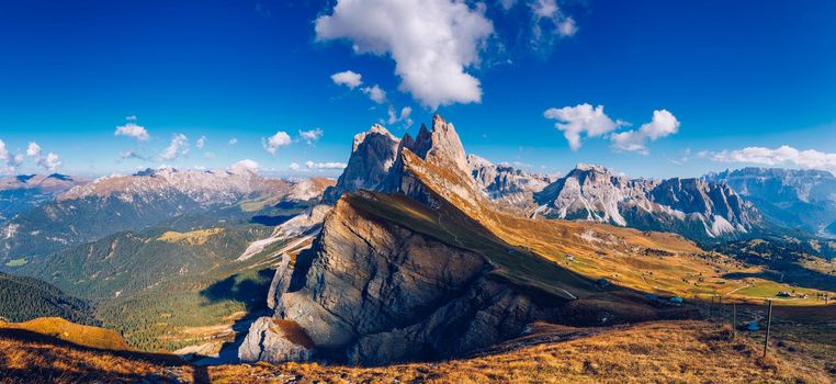 Seceda in autumn in South Tyrol in the Alps of North Italy. Views from Seceda over the Odle mountains in autumn with fall colors. Seceda, Val Gardena, Trentino Alto Adige, South Tyrol in Italy.