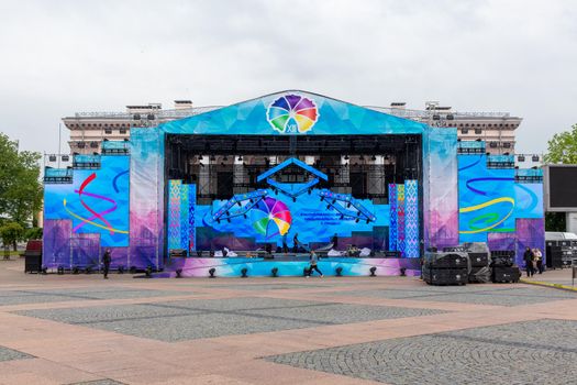 Grodno, Belarus 01.06.2022: Workers assemble stage constructions before the Republican Festival of National Cultures in the Soviet square.