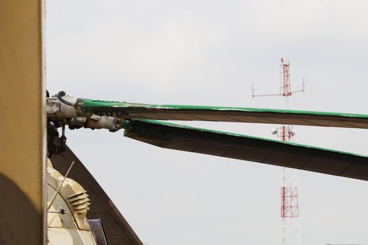 Russian military attack helicopter rotor blades detail close-up abstract with radio tower