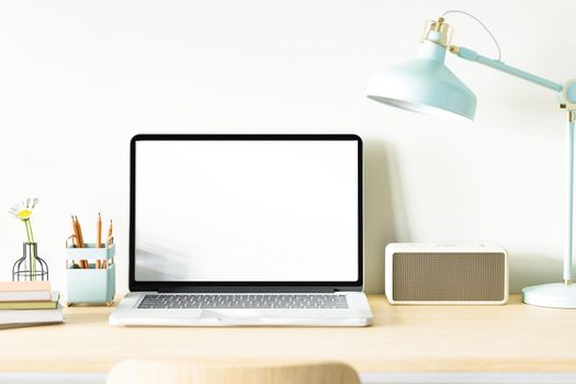 Mockup of laptop computer and blank laptop screen mockup on desk