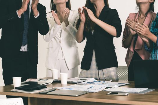 Business people applauding in a business meeting. Conference and presentation award concept.