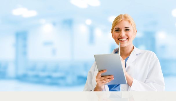 Doctor using tablet computer at the hospital. Medical healthcare and doctor staff service.