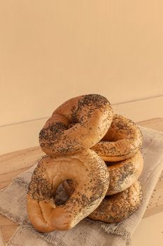 Some delicious bagels with poppy seeds on a napkin close-up. Front view.