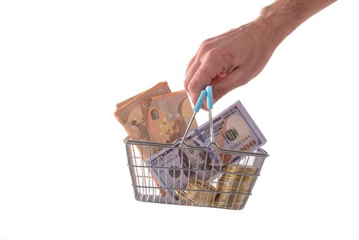 Toy supermarket cart or shopping trolley with money isolated on white background close-up