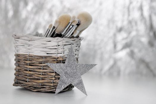 Professional visagiste brushes aisle in makeup studio.Beauty salon background