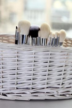 A set of makeup brushes in their container