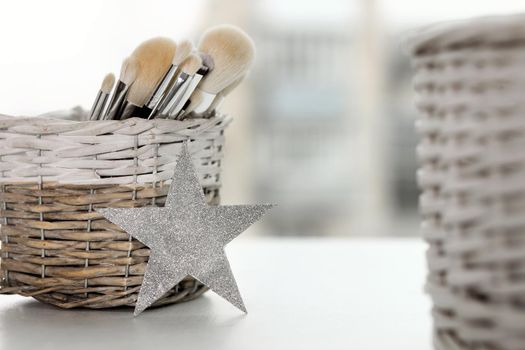 A set of makeup brushes in their container