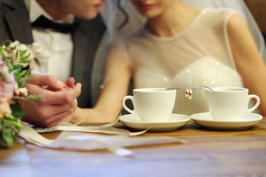 Coffee time, coffee break. Wedding day. Couple in cafe