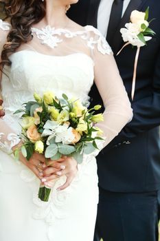 wedding bouquet in bride's hands