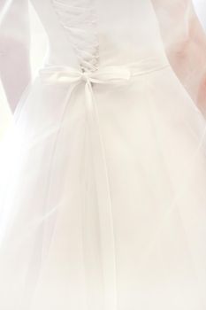 Bride dressing wedding gown