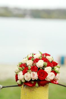 top view of luxury bouquet of red and white flowers top view with red bow on wedding day