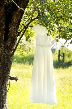 Bride dressing wedding gown