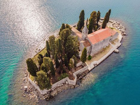Aerophotography. View from flying drone. St George Island in the Bay of Kotor at Perast in Montenegro, with St George Benedictine Monastery. St. George Island, is a small natural island off the coast of Perast in Bay of Kotor, Montenegro.