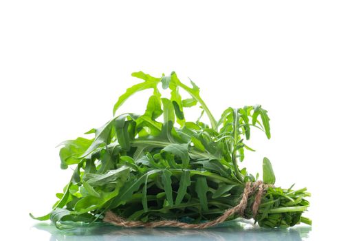 bunch of fresh organic green arugula isolated on white background