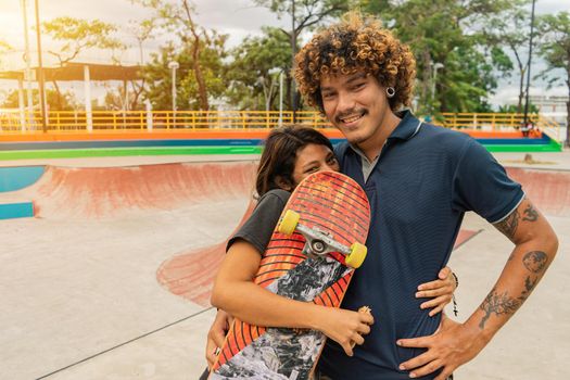Skater couple in a park enjoying their urban lifestyle in Managua Nicaragua