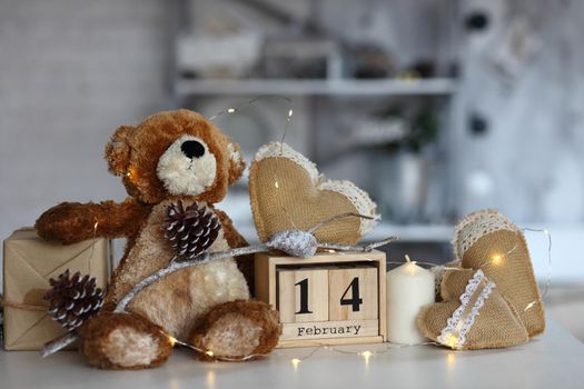 Teddy Bear with heart sitting on wood table, Valentine's day and love concept