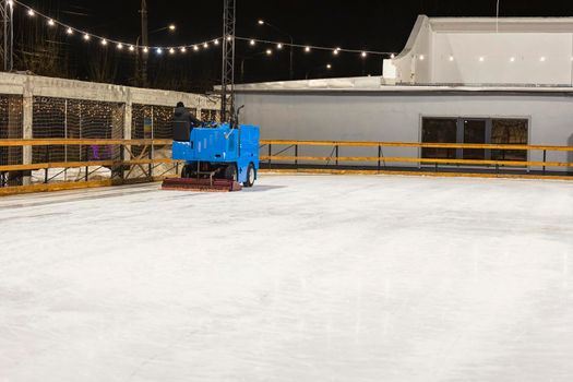 machine leveling the ice on the skating rink