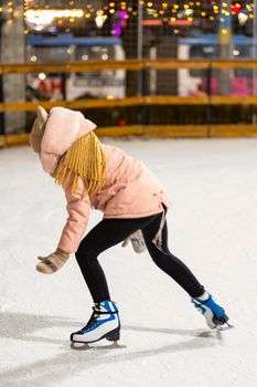 girl skating on the ice rink